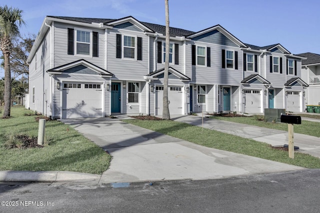 view of front of home with a front yard, central AC unit, and a garage