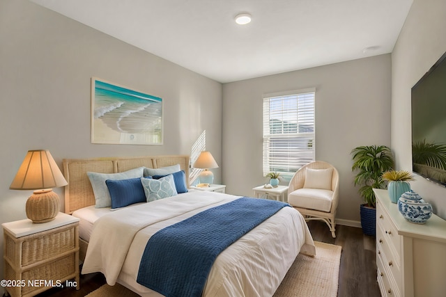 bedroom featuring dark hardwood / wood-style floors