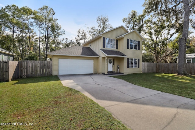 view of property with a front yard and a garage