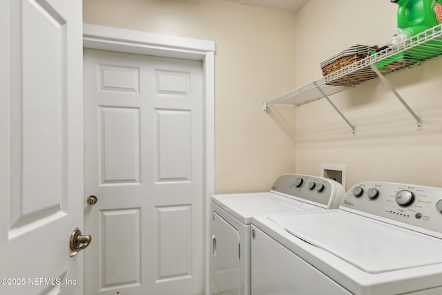 clothes washing area featuring washing machine and dryer