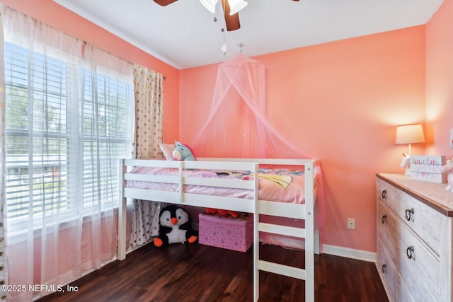 bedroom with ceiling fan and dark hardwood / wood-style floors