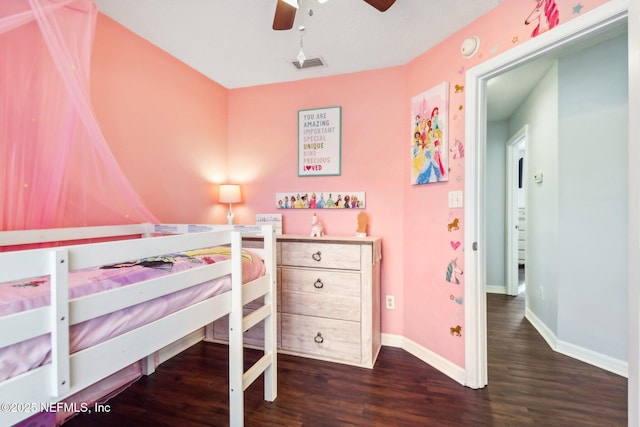 bedroom with ceiling fan and dark wood-type flooring