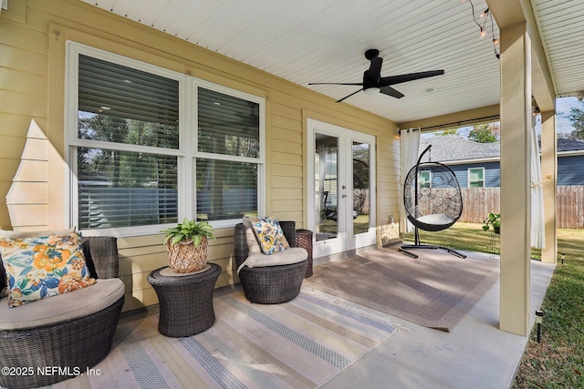 view of patio featuring ceiling fan and french doors