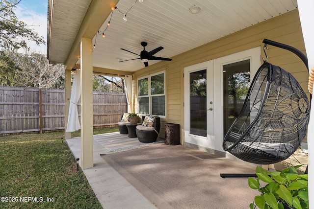 view of patio featuring ceiling fan and french doors