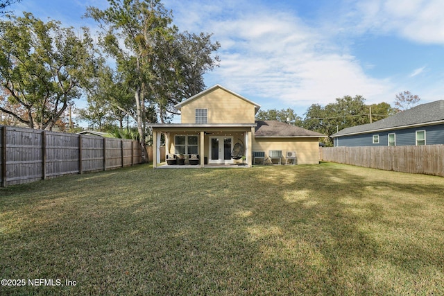 back of property featuring an outdoor hangout area, a yard, and a patio