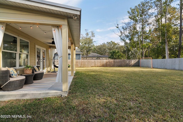 view of yard featuring ceiling fan