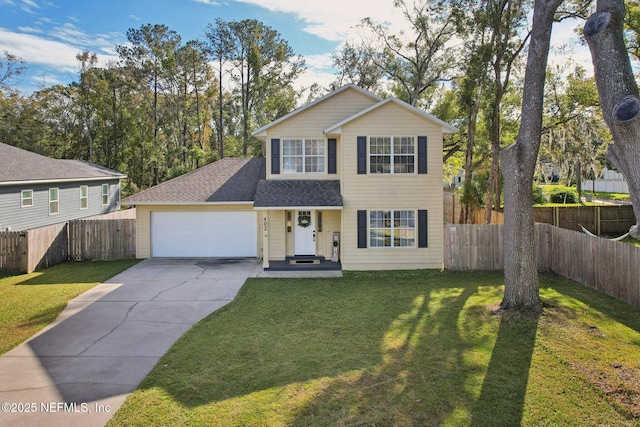 view of front of home featuring a front yard and a garage