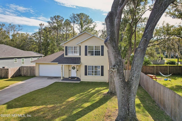 view of front facade featuring a front yard and a garage