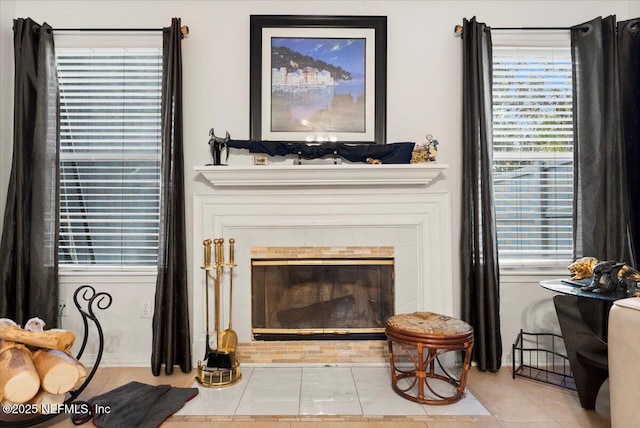 sitting room with a wealth of natural light and light tile patterned flooring