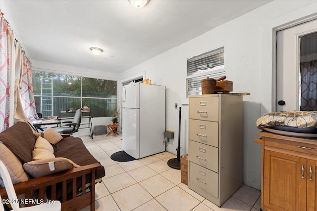 kitchen featuring light tile patterned floors and white refrigerator