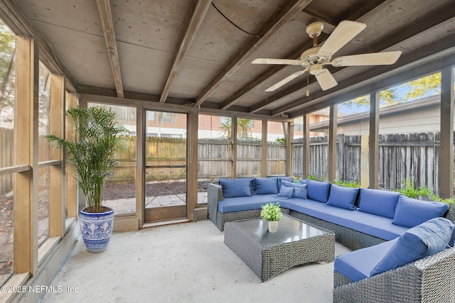 sunroom / solarium featuring ceiling fan