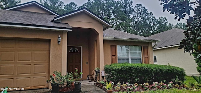 entrance to property featuring a garage