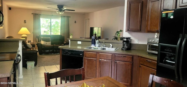 kitchen with light tile patterned floors, ceiling fan, and black appliances