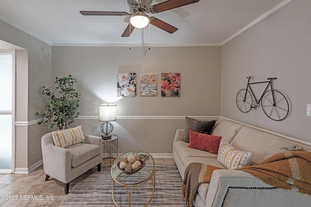 living area featuring ceiling fan, crown molding, light tile patterned floors, and a textured ceiling