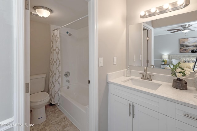 full bathroom featuring shower / bath combination with curtain, vanity, toilet, and ceiling fan