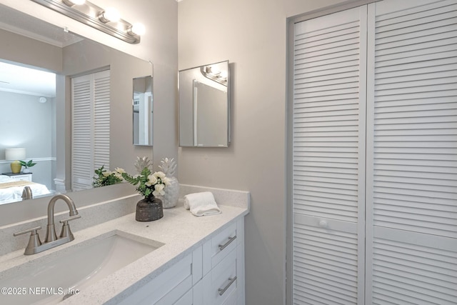 bathroom featuring vanity and ornamental molding