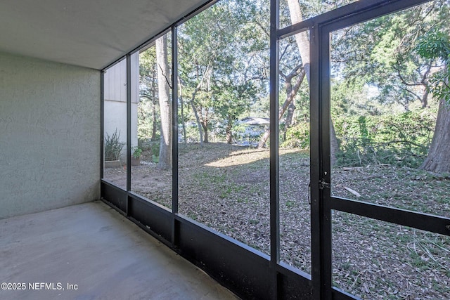 unfurnished sunroom featuring a healthy amount of sunlight