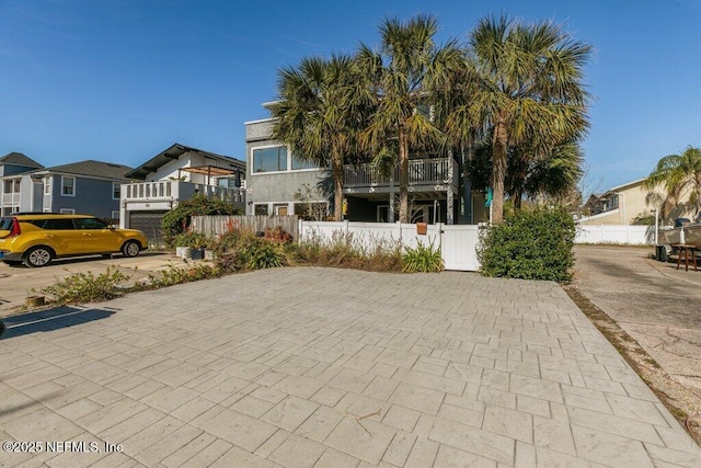 view of front of home featuring a balcony