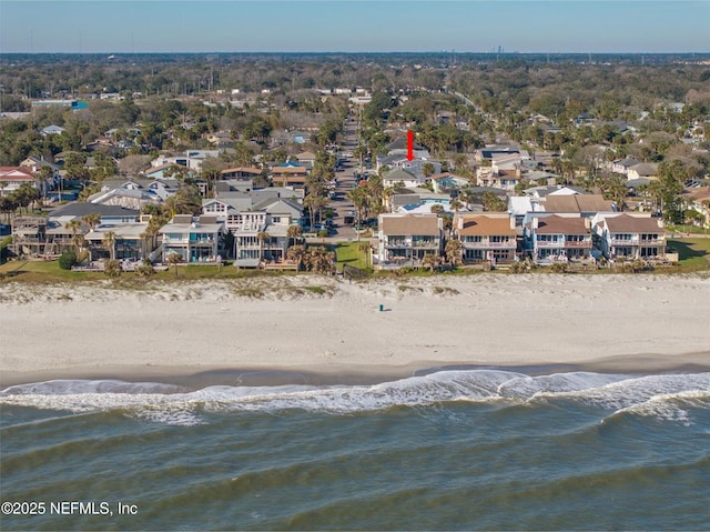 bird's eye view featuring a water view and a view of the beach