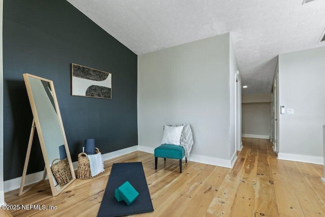 sitting room featuring hardwood / wood-style floors