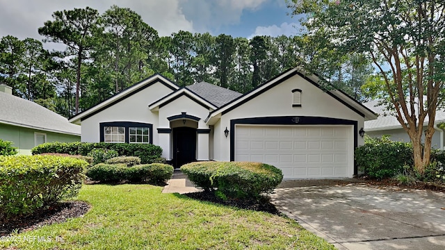 single story home with a front yard and a garage