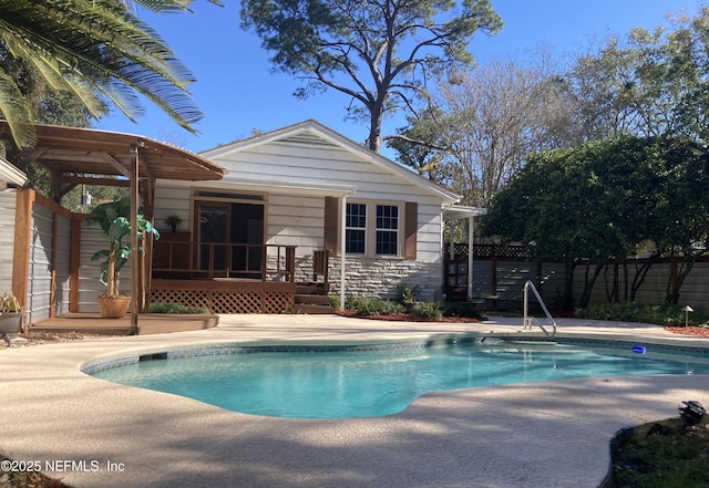 view of swimming pool with a patio area