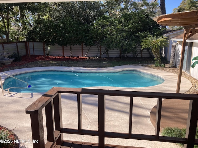 view of swimming pool with a patio area