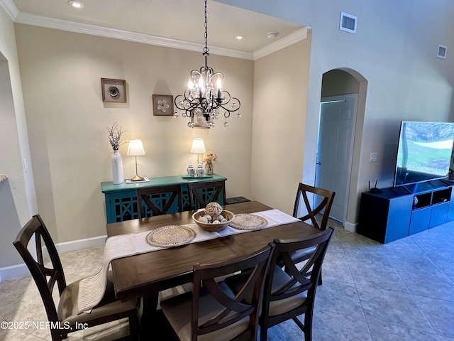 tiled dining space with crown molding and a chandelier