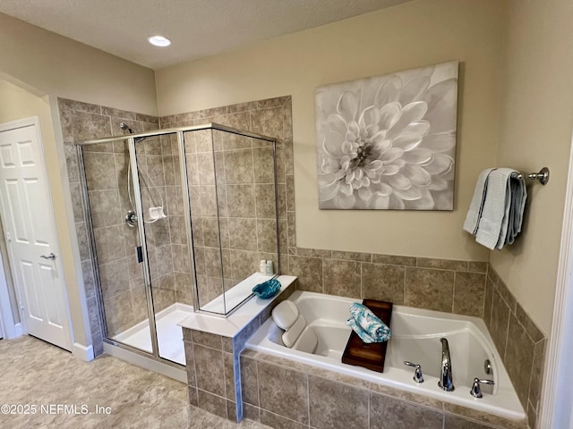 bathroom featuring separate shower and tub