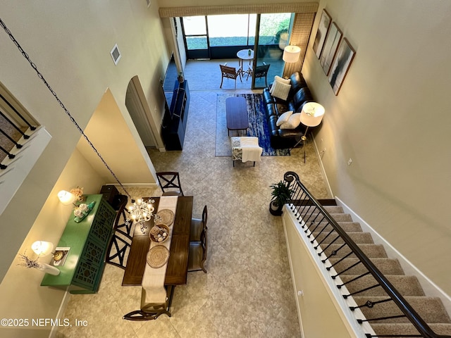 living room with a high ceiling