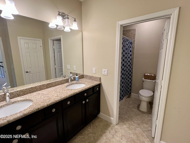 bathroom with tile patterned flooring, a shower with curtain, vanity, and toilet