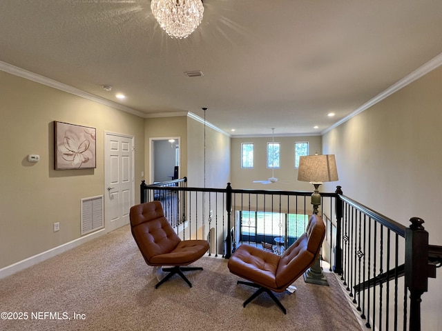 living area with carpet flooring, a chandelier, and ornamental molding