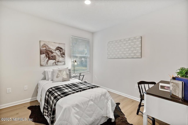 bedroom featuring hardwood / wood-style floors