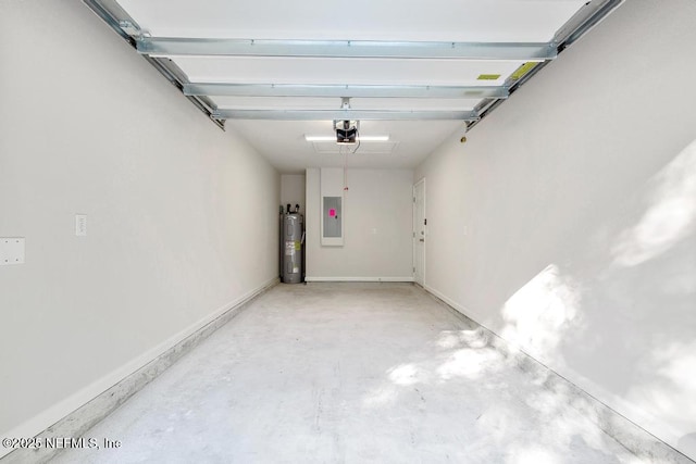 garage featuring electric water heater, electric panel, and a garage door opener