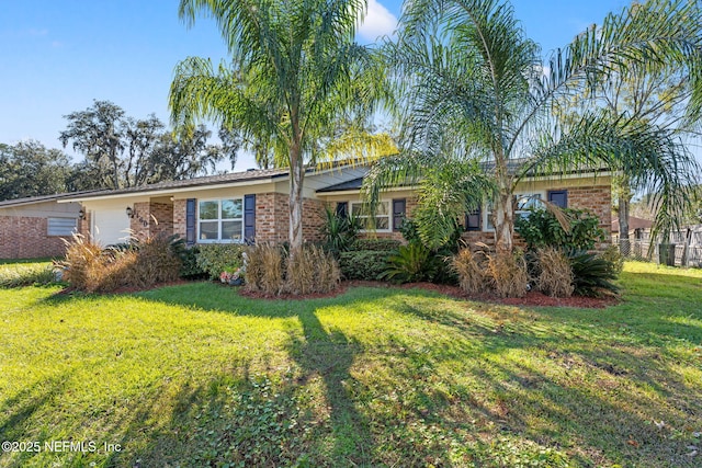 ranch-style house featuring a front yard