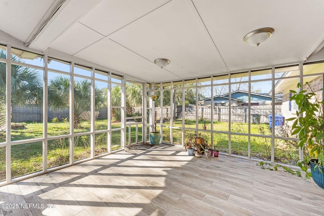 unfurnished sunroom with a wealth of natural light