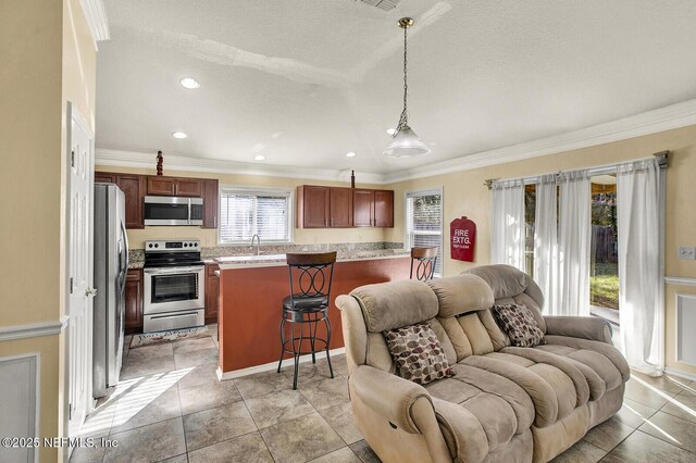 living room featuring crown molding, light tile patterned flooring, and a textured ceiling