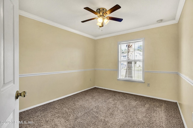 empty room featuring carpet, ceiling fan, and crown molding