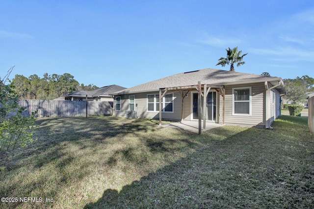 back of house featuring a patio area, a yard, and central air condition unit