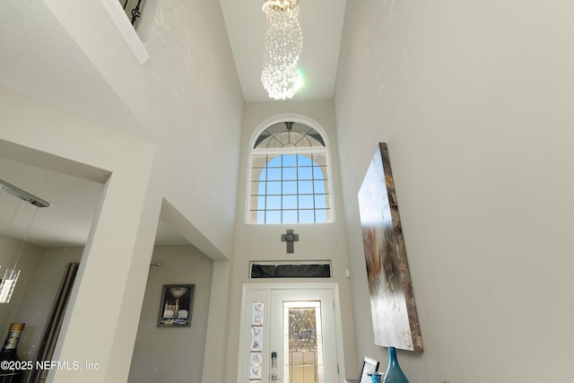 entrance foyer with a high ceiling and an inviting chandelier