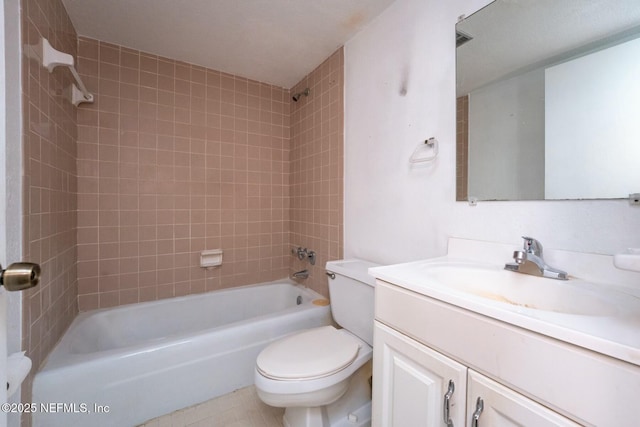 full bathroom featuring vanity, tiled shower / bath combo, and toilet