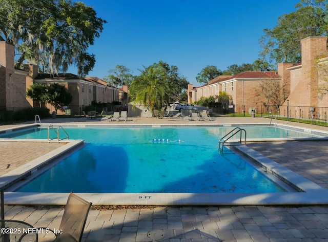 view of swimming pool with a patio area