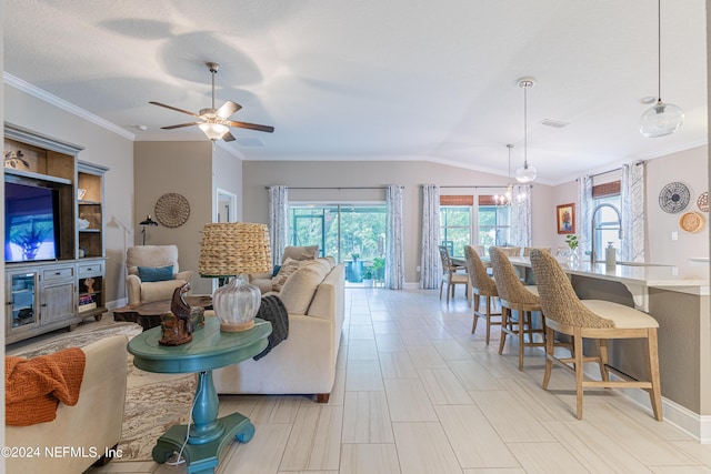 living room featuring ceiling fan with notable chandelier, a textured ceiling, crown molding, sink, and lofted ceiling