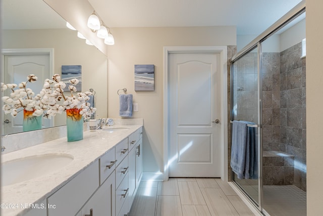 bathroom with vanity and an enclosed shower