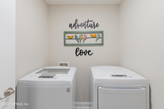 clothes washing area featuring washing machine and clothes dryer