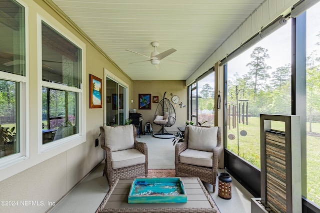 sunroom featuring ceiling fan