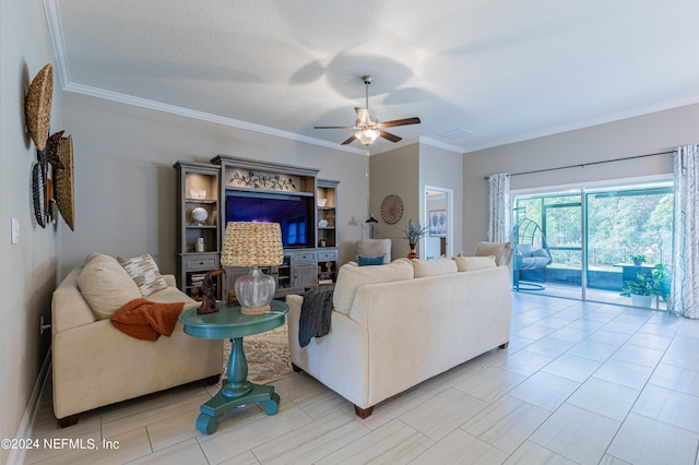 living room with crown molding, ceiling fan, and a textured ceiling