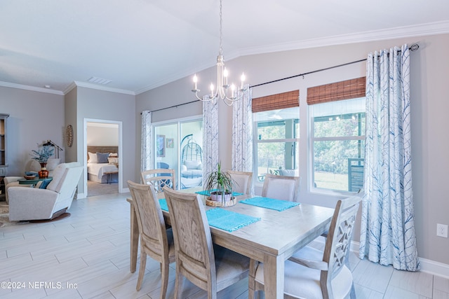 dining area featuring ornamental molding, lofted ceiling, and a notable chandelier