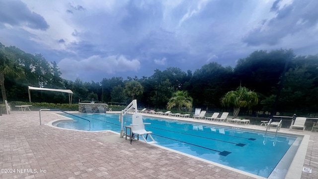 view of swimming pool featuring a patio