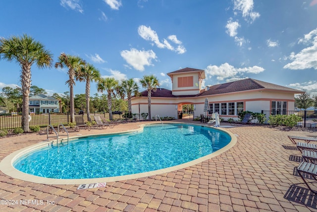 view of swimming pool featuring a patio